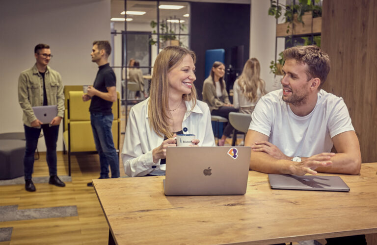 People collaborating in an office environment, representing BlueSoft and Orange's AI-based KnowMe solution that supports intelligent candidate profiling and recruitment processes.